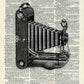 Vintage camera on dictionary background 8 x 10 Print